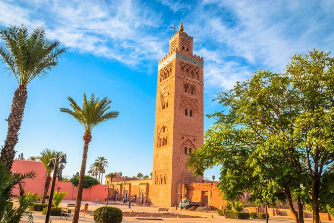 Koutoubia Mosque minaret in Marrakech surrounded by palm trees